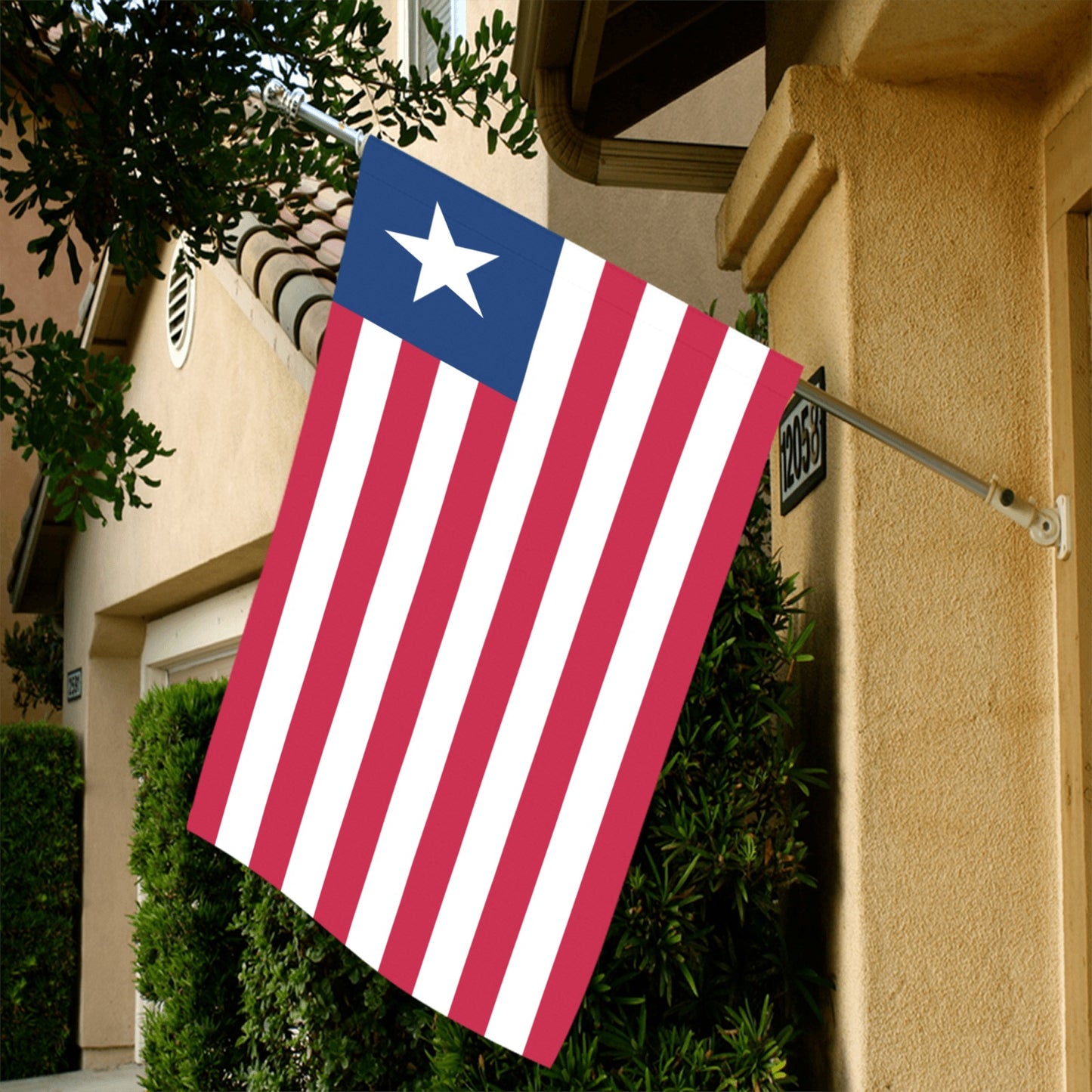[Luv My Flag] patriotic flag displayed outside suburban house.