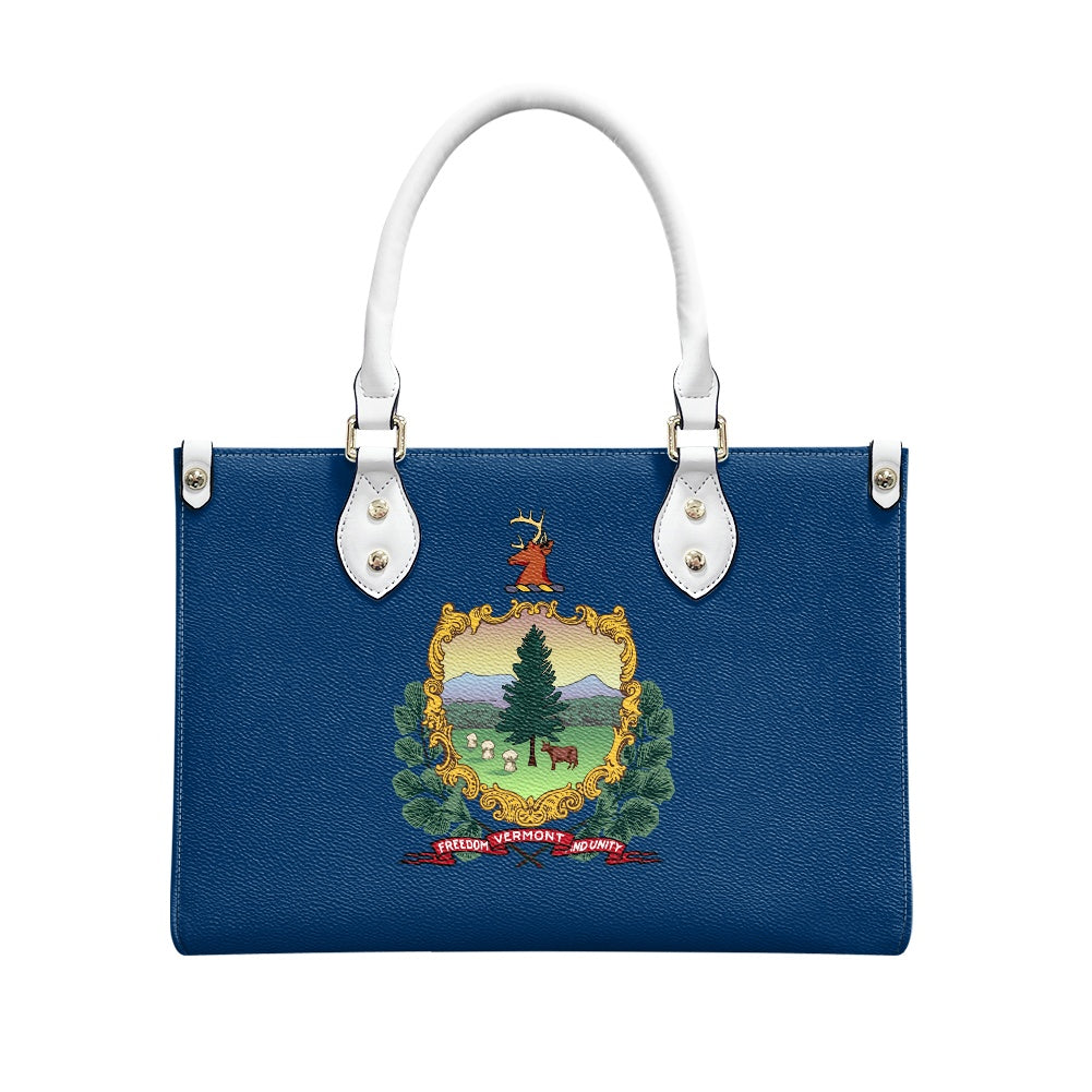 Blue handbag with Vermont emblem, white handles, by [Brand].