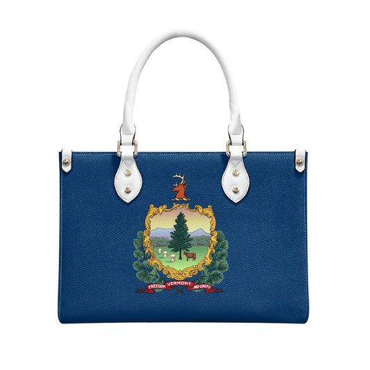 Blue handbag with Vermont emblem, white handles, by [Brand].