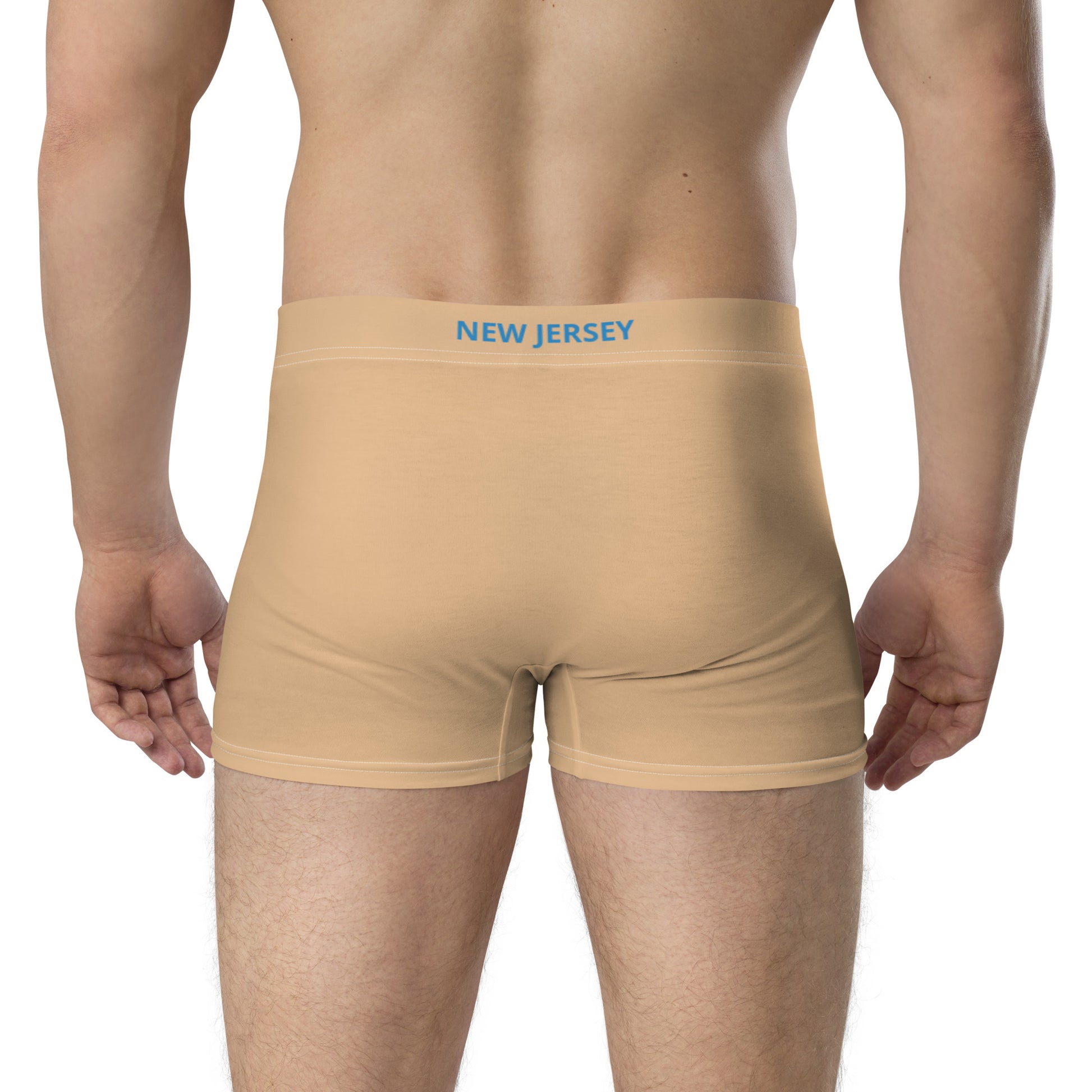 Back view of person wearing [Brand] beige boxer briefs.
