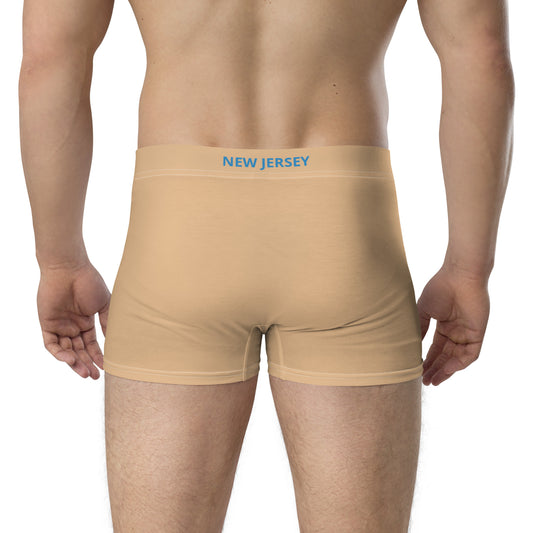 Back view of person wearing [Brand] beige boxer briefs.
