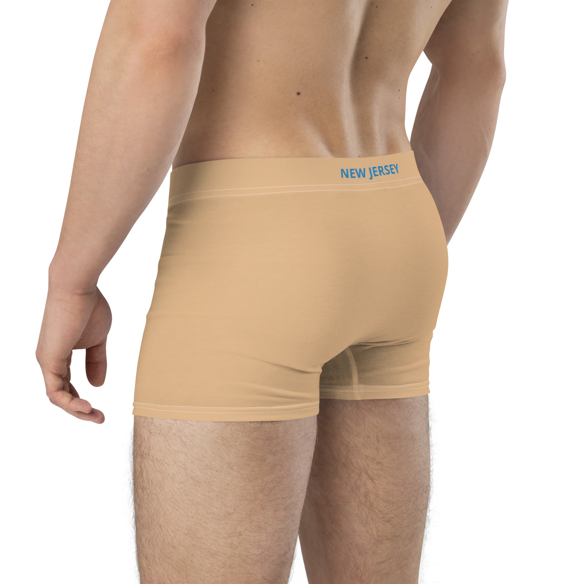 Back view of [Brand] nude men's boxer briefs, branded waistband.