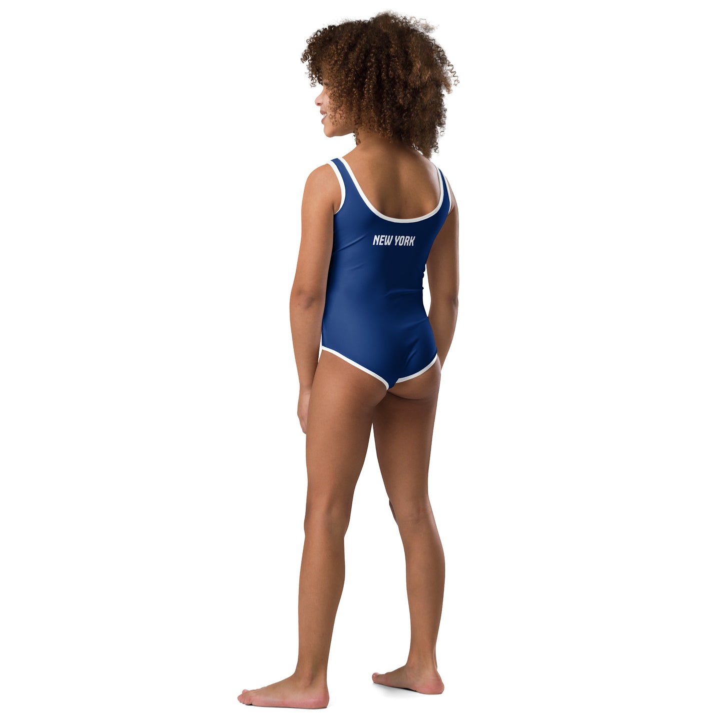 Girl in blue [Brand] swimsuit with "New York" text.
