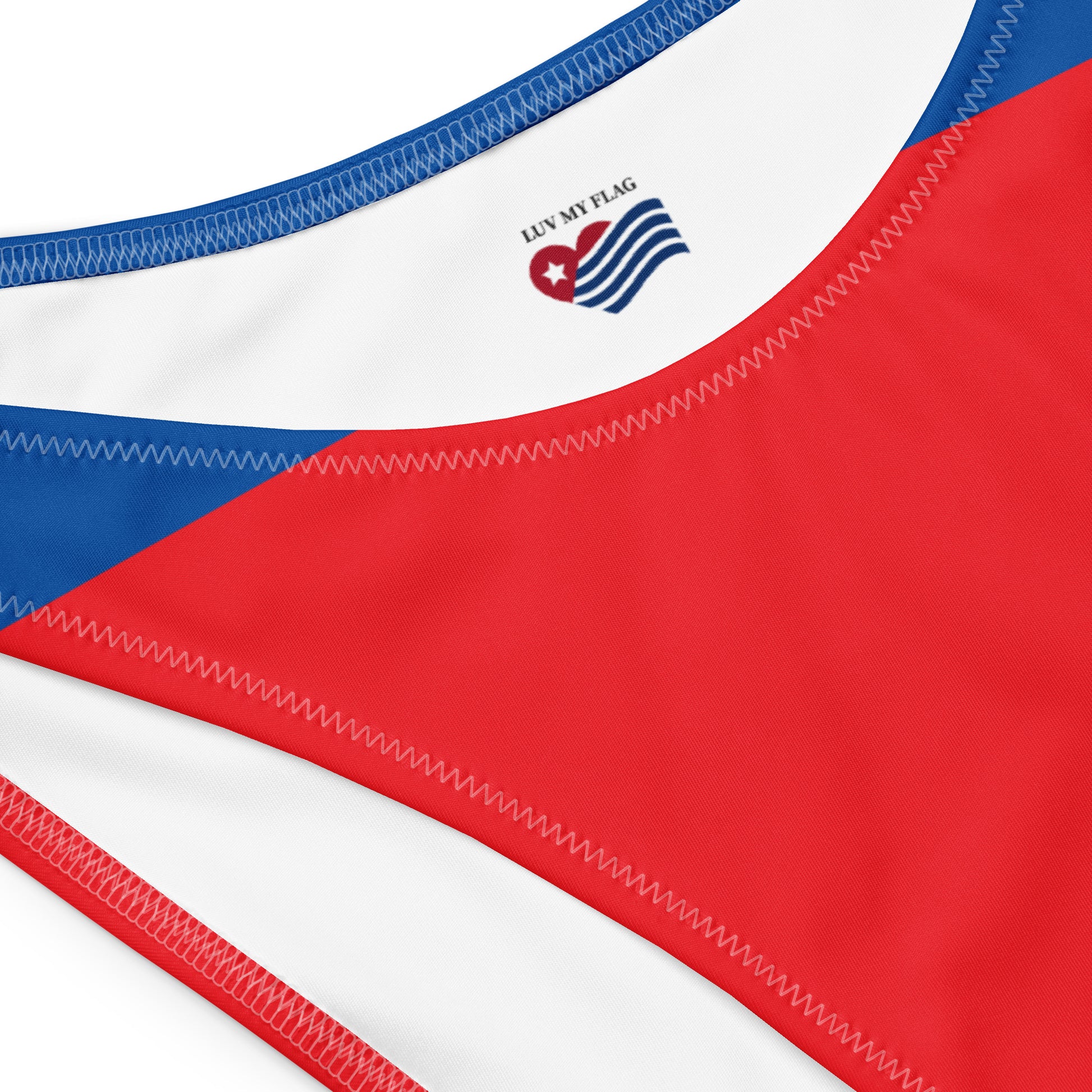 Red, white, blue swimsuit detail with [Brand] logo visible.