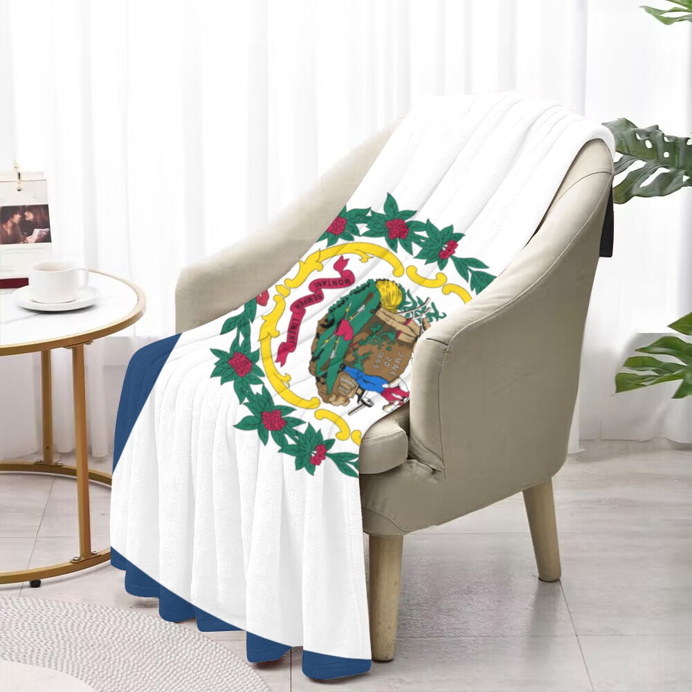 A [Luv My Flag] blanket with colorful emblem design.