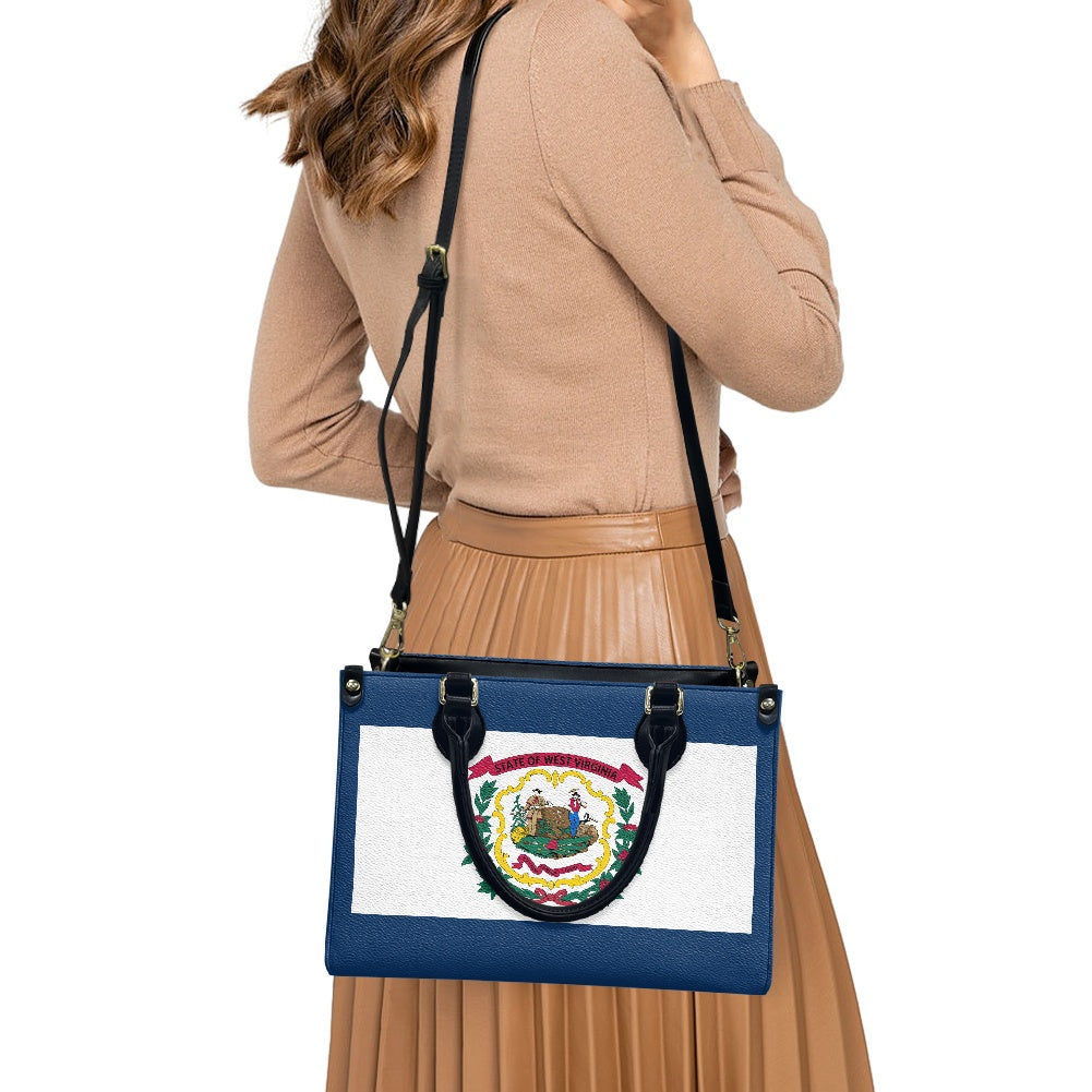 Woman carries [Brand] handbag featuring West Virginia state flag.