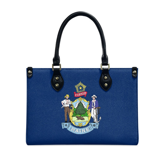 Blue handbag featuring Maine state emblem, black handles. [Brand]