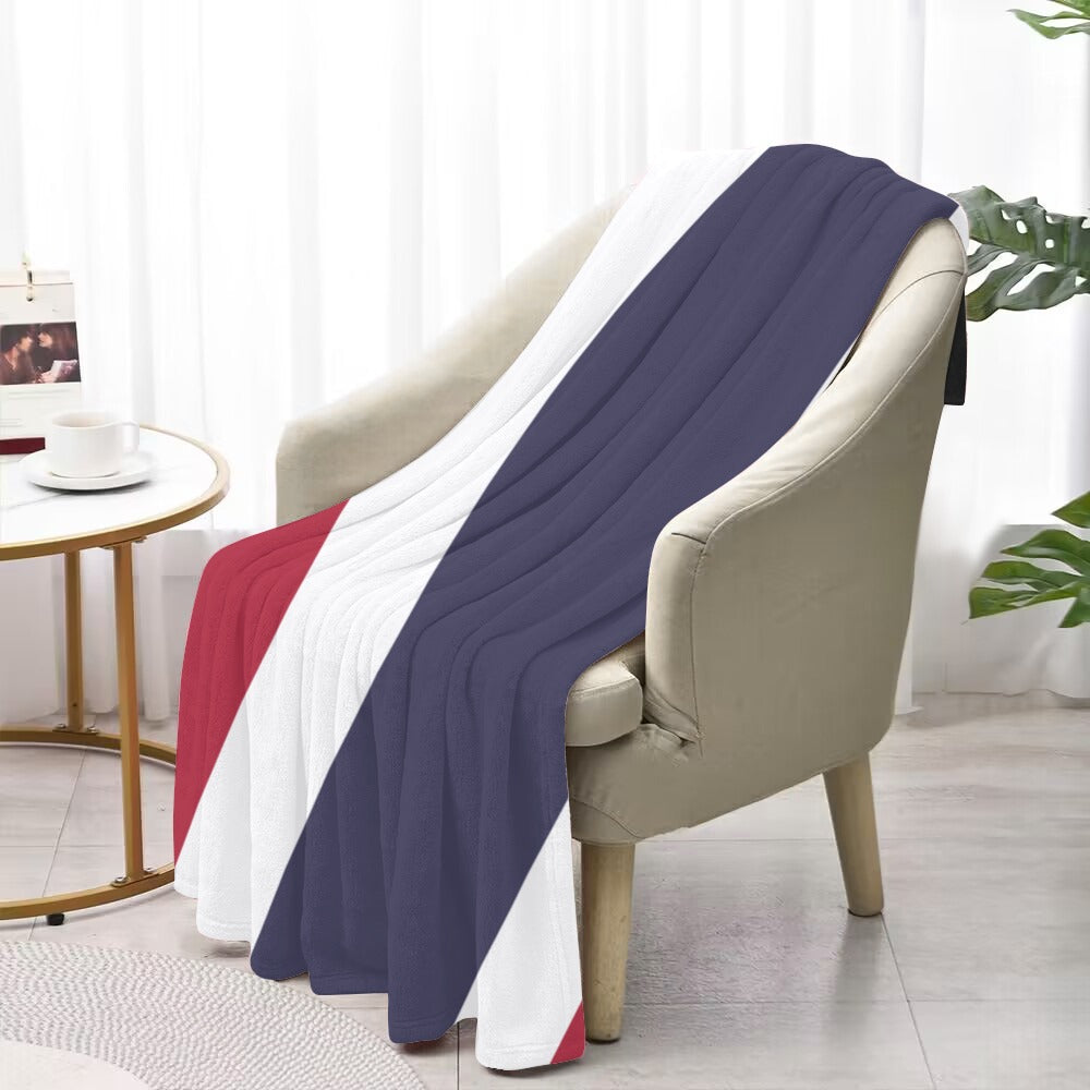 Luv My Flag blanket on beige chair, contemporary room setting.
