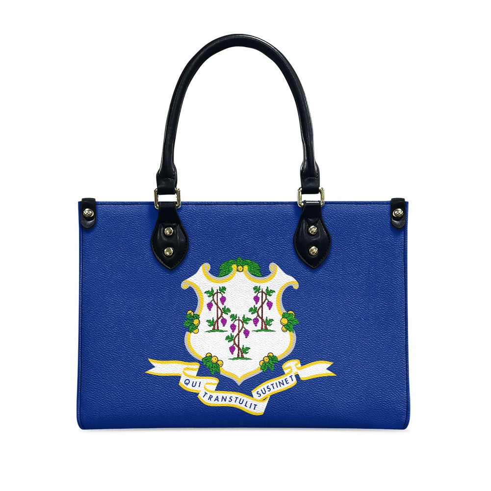 Blue handbag with Connecticut seal, black handles, by [Brand].