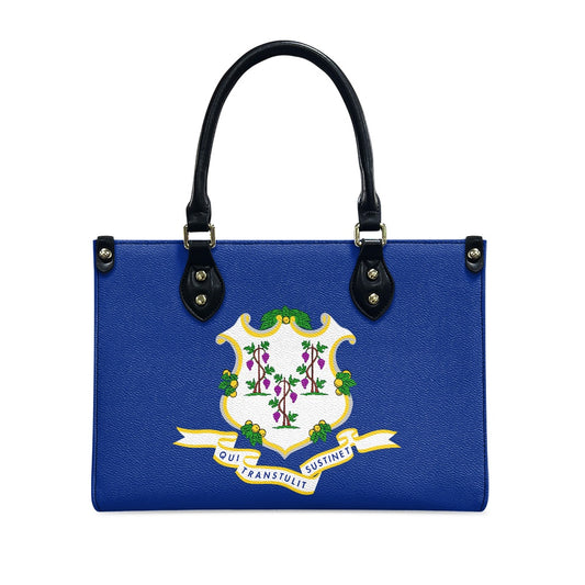 Blue handbag with Connecticut seal, black handles, by [Brand].