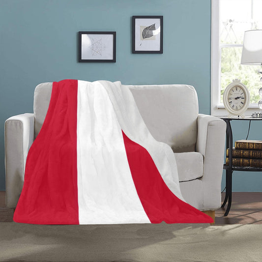 Cozy Luv My Flag blanket on a beige sofa.