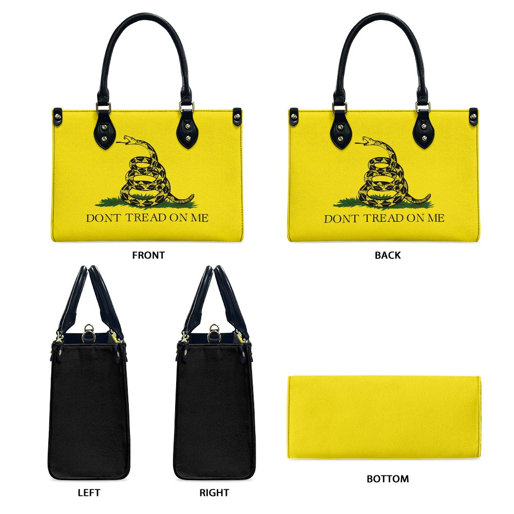 Yellow [Brand] handbag with snake design, "Don't Tread On Me."