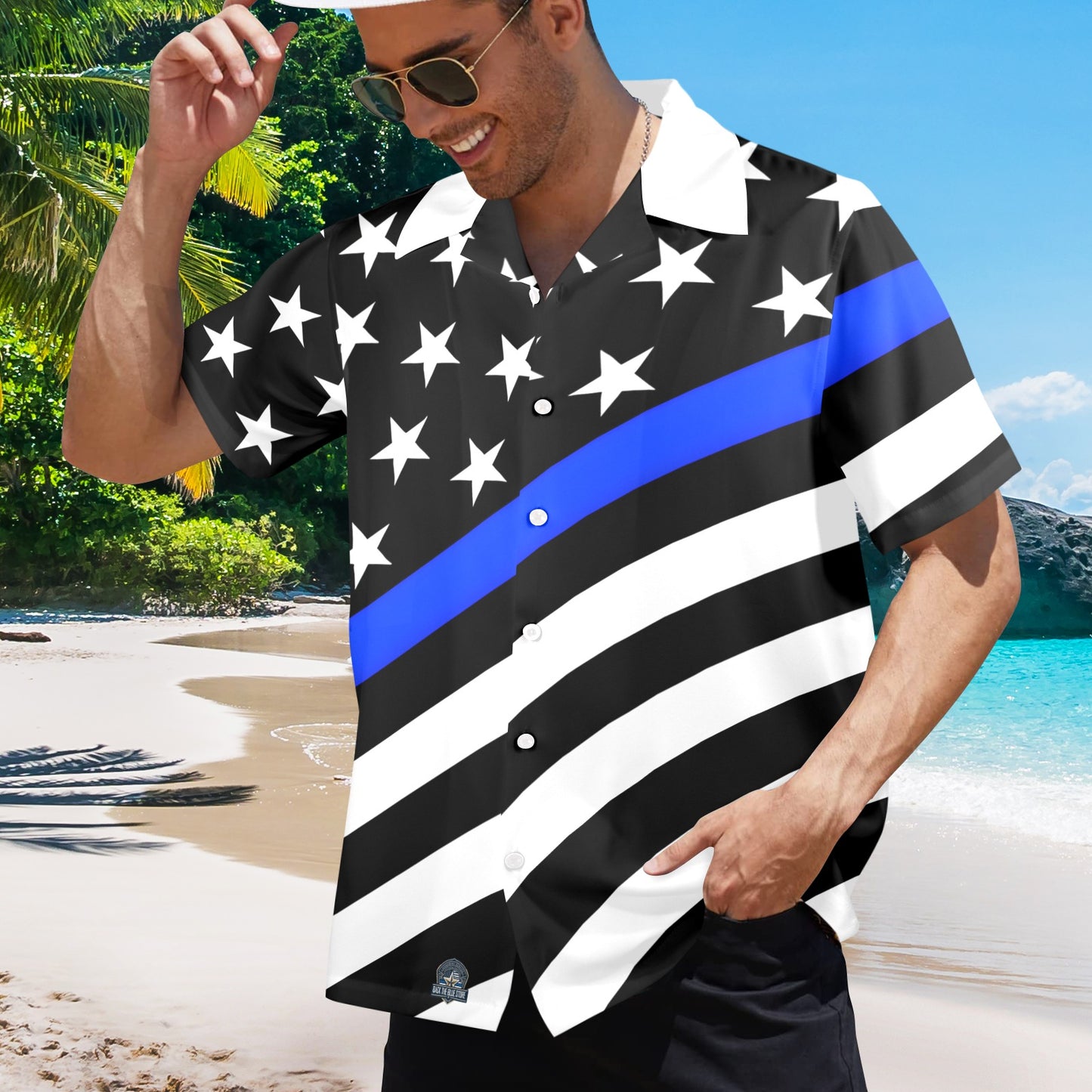 Man wearing [Brand] patriotic beach shirt with stars, stripes.