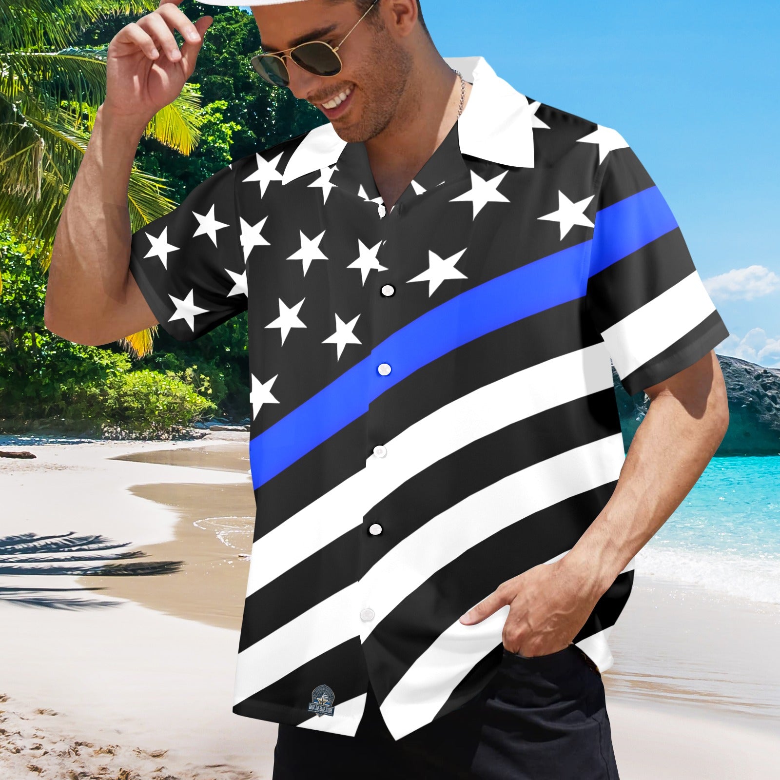 Man wearing [Brand] patriotic beach shirt with stars, stripes.