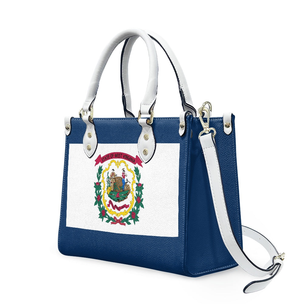 Blue leather handbag featuring West Virginia emblem, by [Brand].