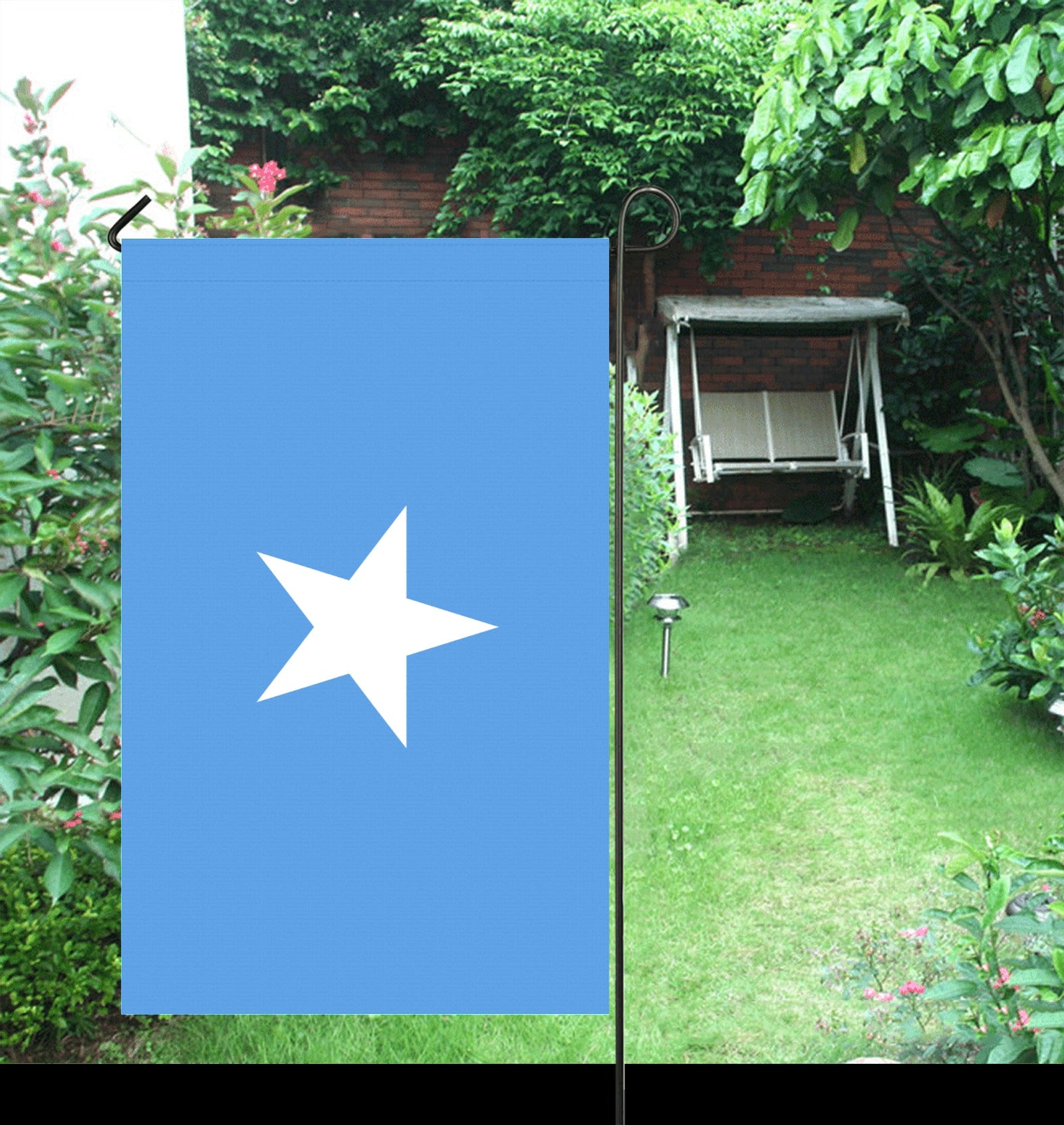 Blue flag with white star, garden background, Luv My Flag.