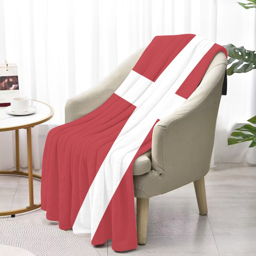 Red and white flag blanket by Luv My Flag, draped.