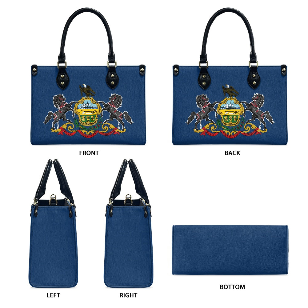 Blue handbag with emblem, black handles. [Brand] design showcase.