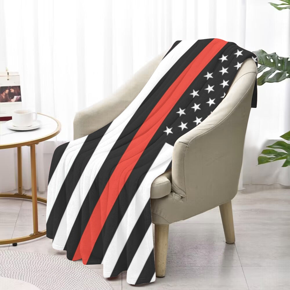 Chair draped with Luv My Flag's striped, starry blanket.