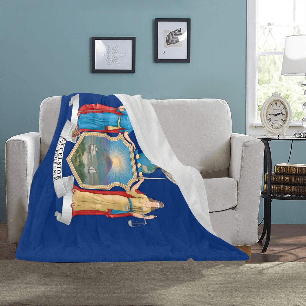 Cozy sofa with Luv My Flag themed throw blanket.