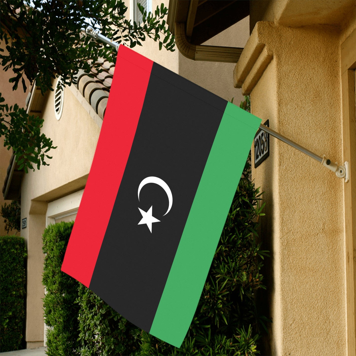 Luv My Flag Libya flag displayed outside a house.