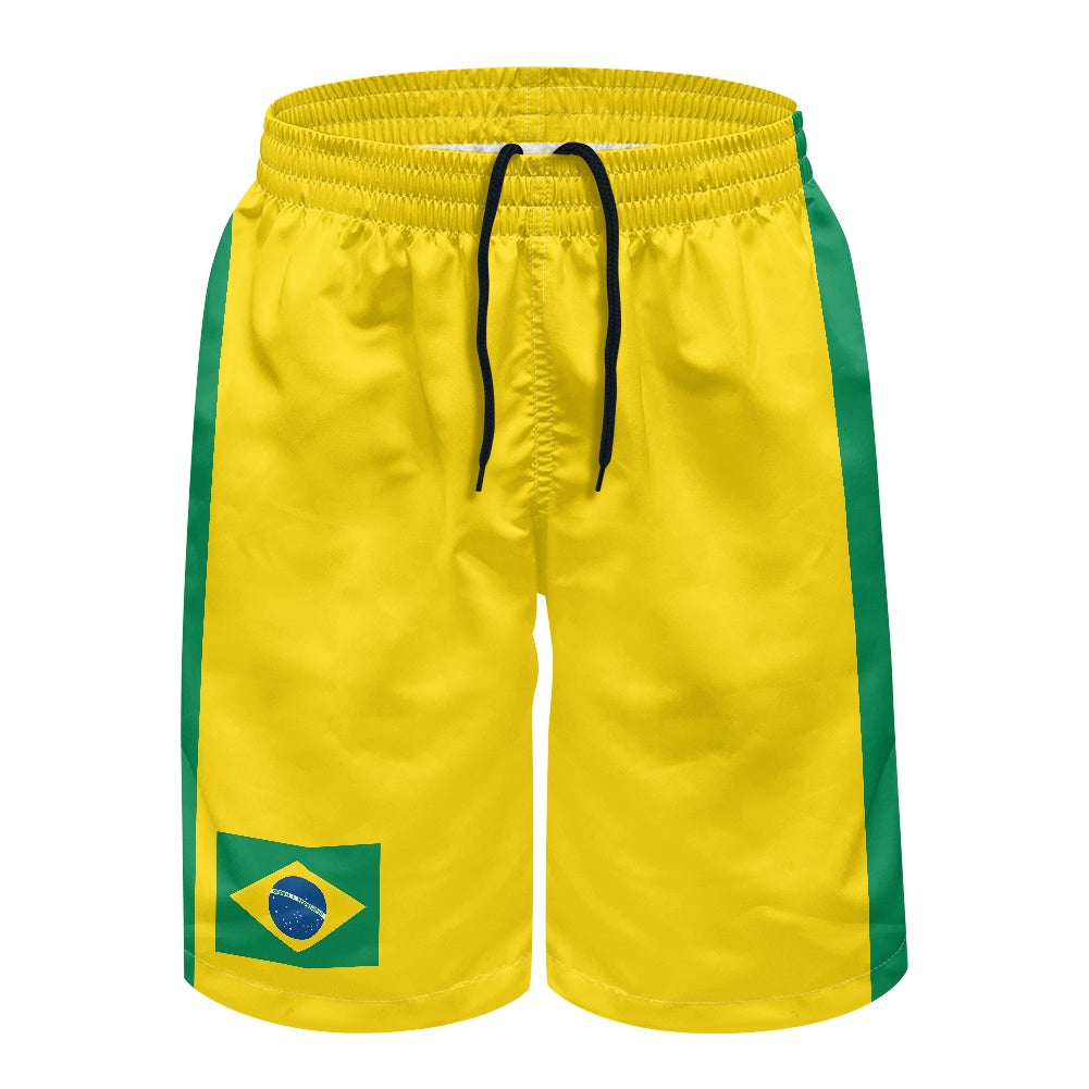 Front view of yellow and green Brazil flag swim trunks with black drawstring and flag patch on right leg, displayed on white background