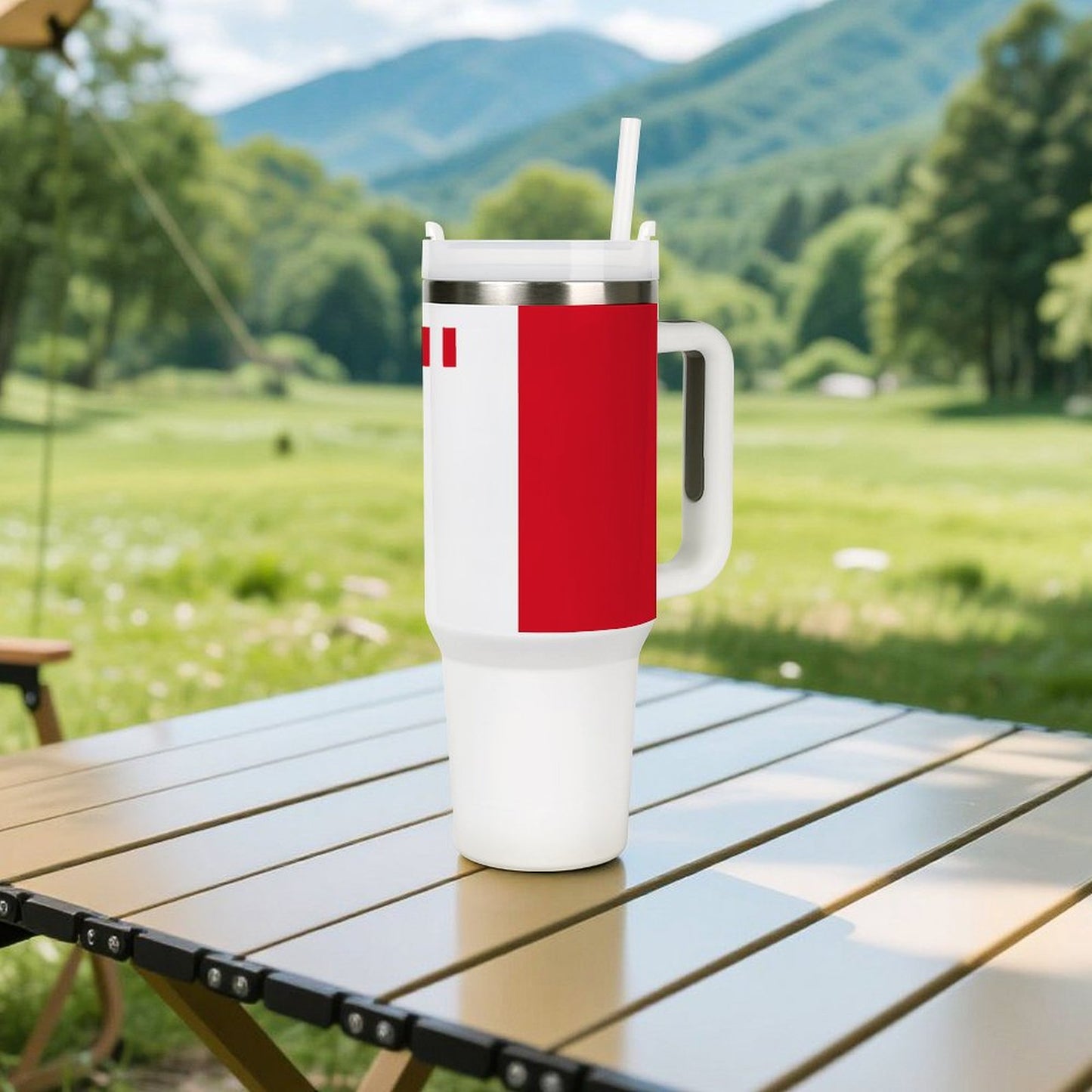 [Brand] insulated tumbler with handle on outdoor picnic table.