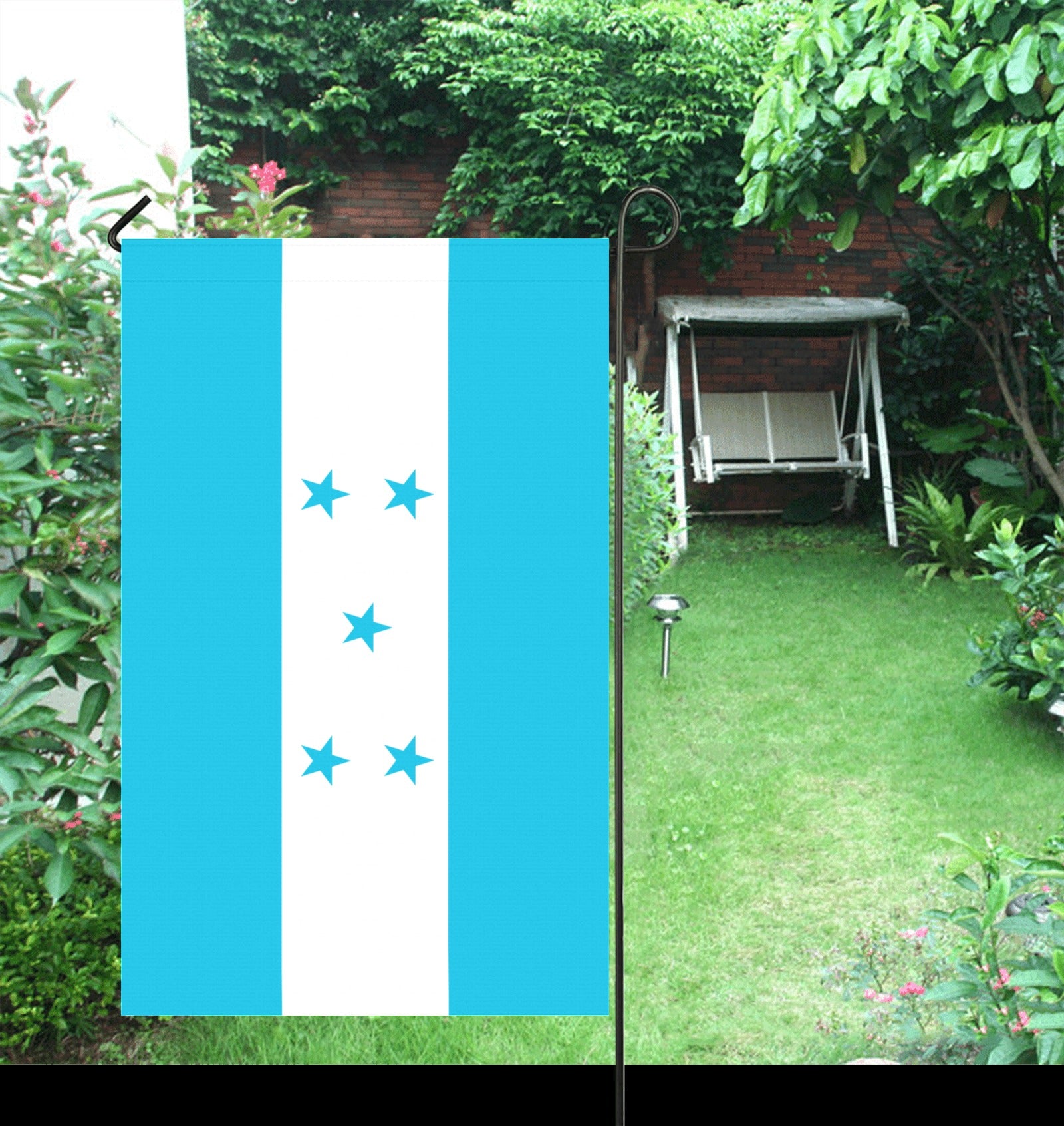 Outdoor garden with Luv My Flag, blue stars design.