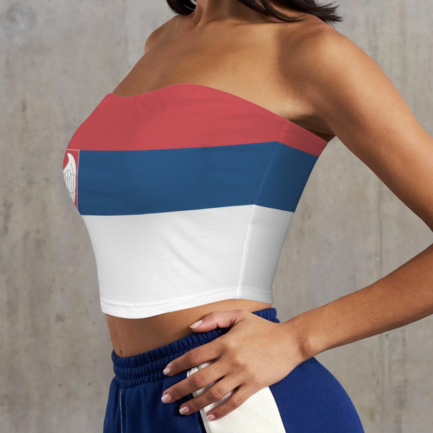 Woman wearing strapless top with [Brand] inspired design.