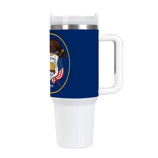 White travel mug featuring Utah state emblem by [Brand].