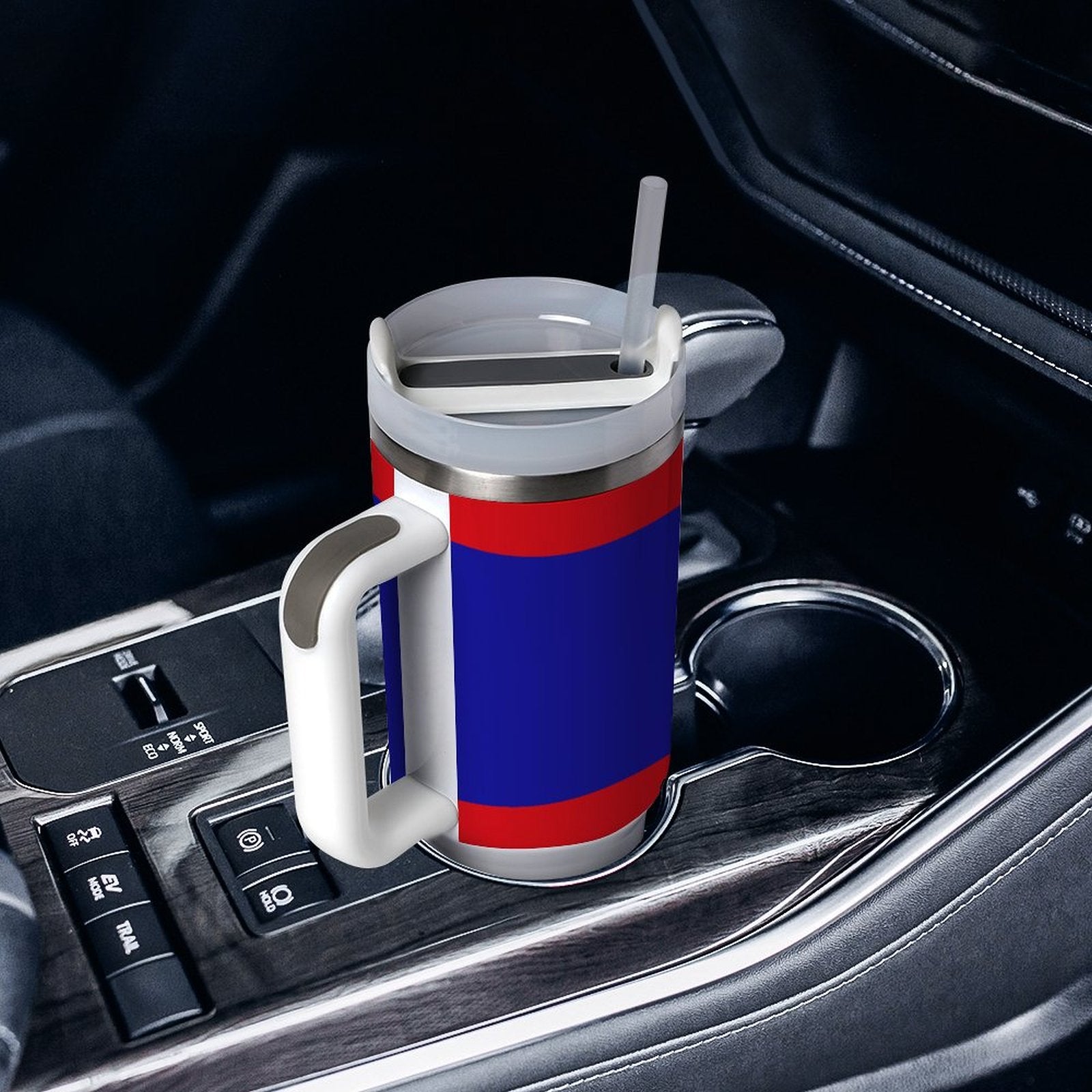 [Brand] mug with handle and straw in car cupholder.