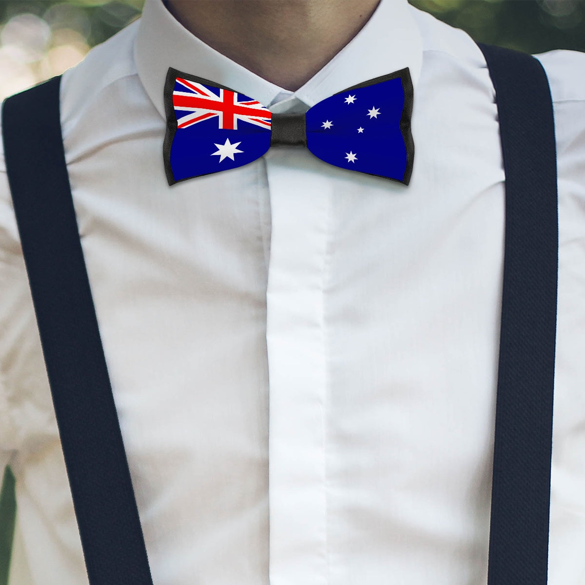 Man in [Brand] shirt with Australian flag bowtie, suspenders.