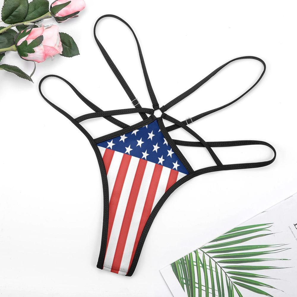 American flag design strappy bikini from [Brand] with flowers nearby.