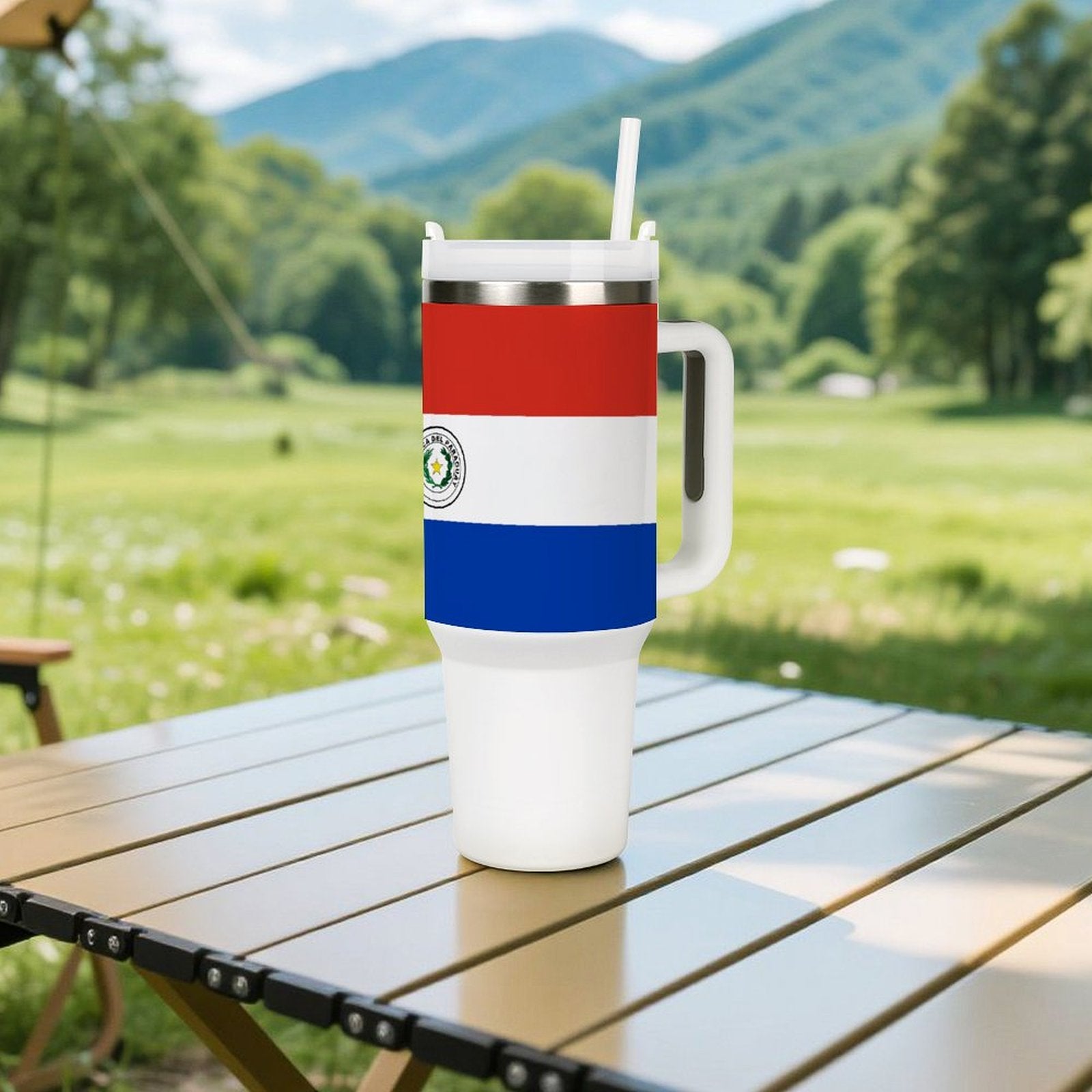 [Brand] tumbler with Paraguay flag design on picnic table.
