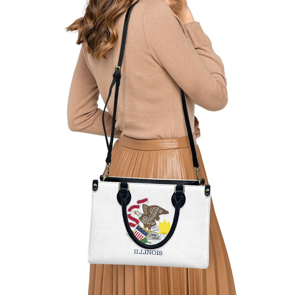 Woman carrying [Brand] Illinois-themed handbag with eagle emblem.