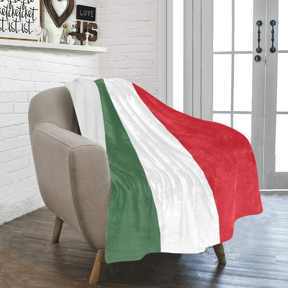 Cozy chair with Luv My Flag Italian-themed blanket draped.