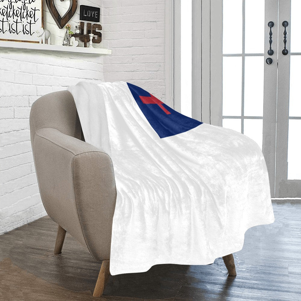 [Alt text: Cozy chair with Luv My Flag blanket draped.]