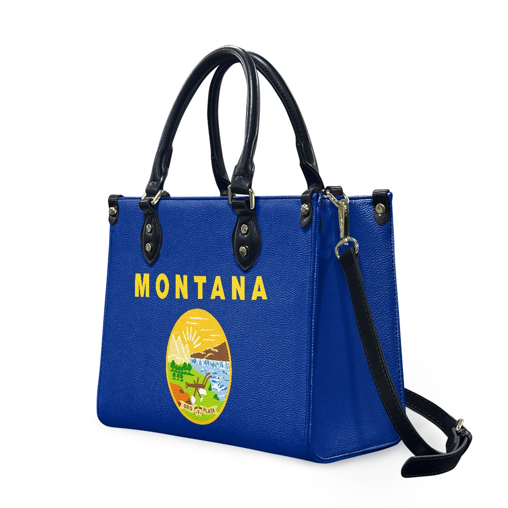 Blue [Brand] handbag with Montana state emblem and handles.