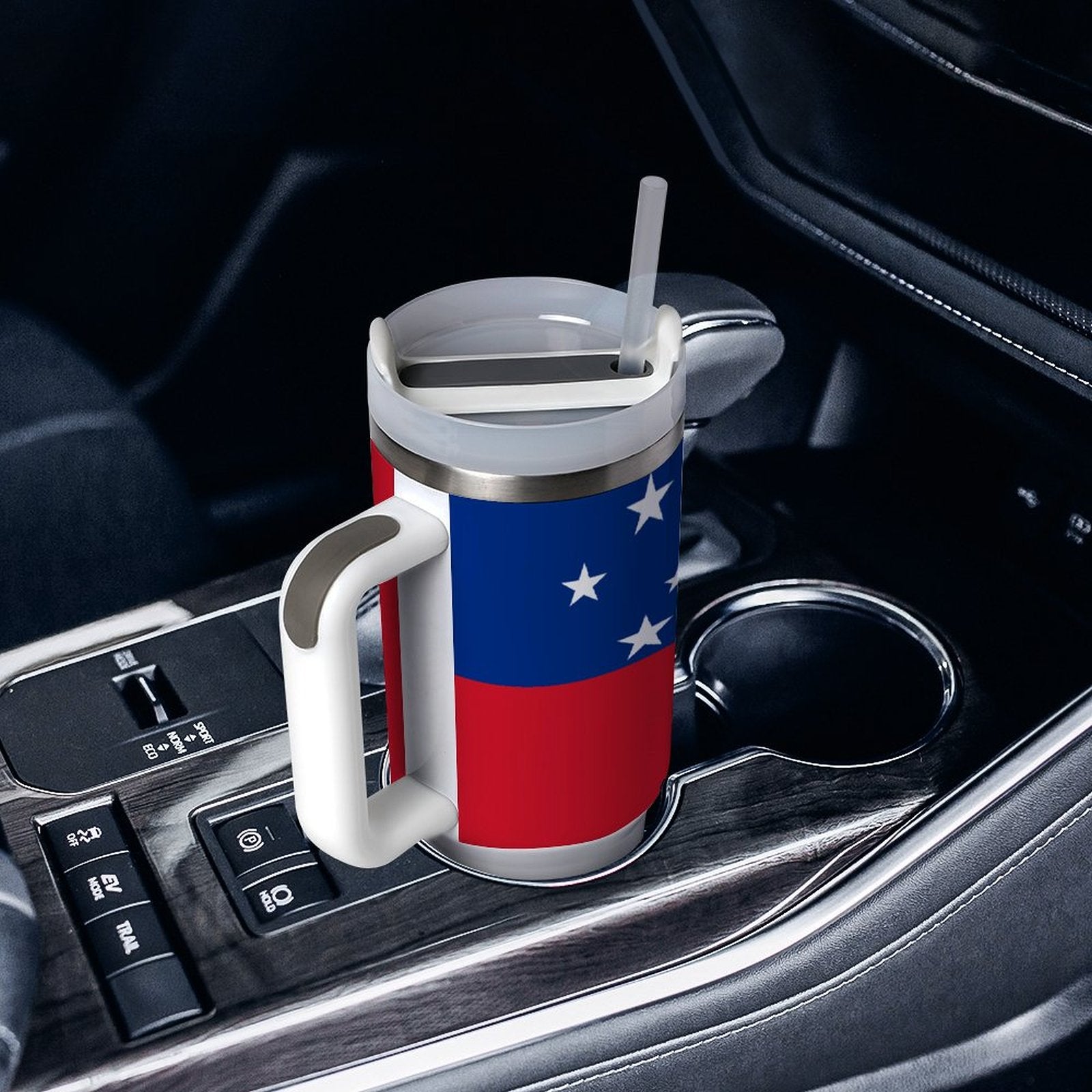 [Brand] mug with flag design in car cup holder.