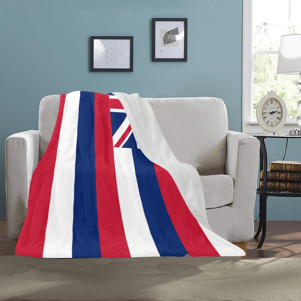 Cozy blanket with [Luv My Flag] design draped on sofa.