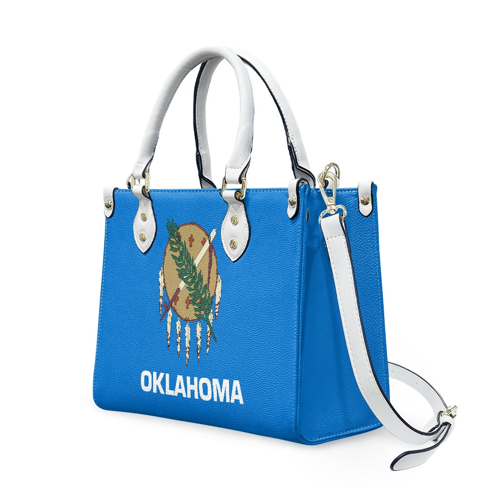 Blue [Brand] handbag with Oklahoma flag design and strap.
