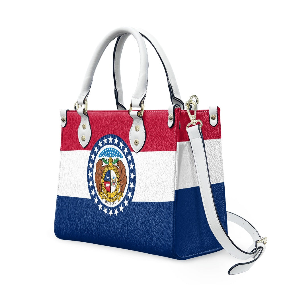 [Brand] handbag featuring Missouri state flag design, detachable strap.