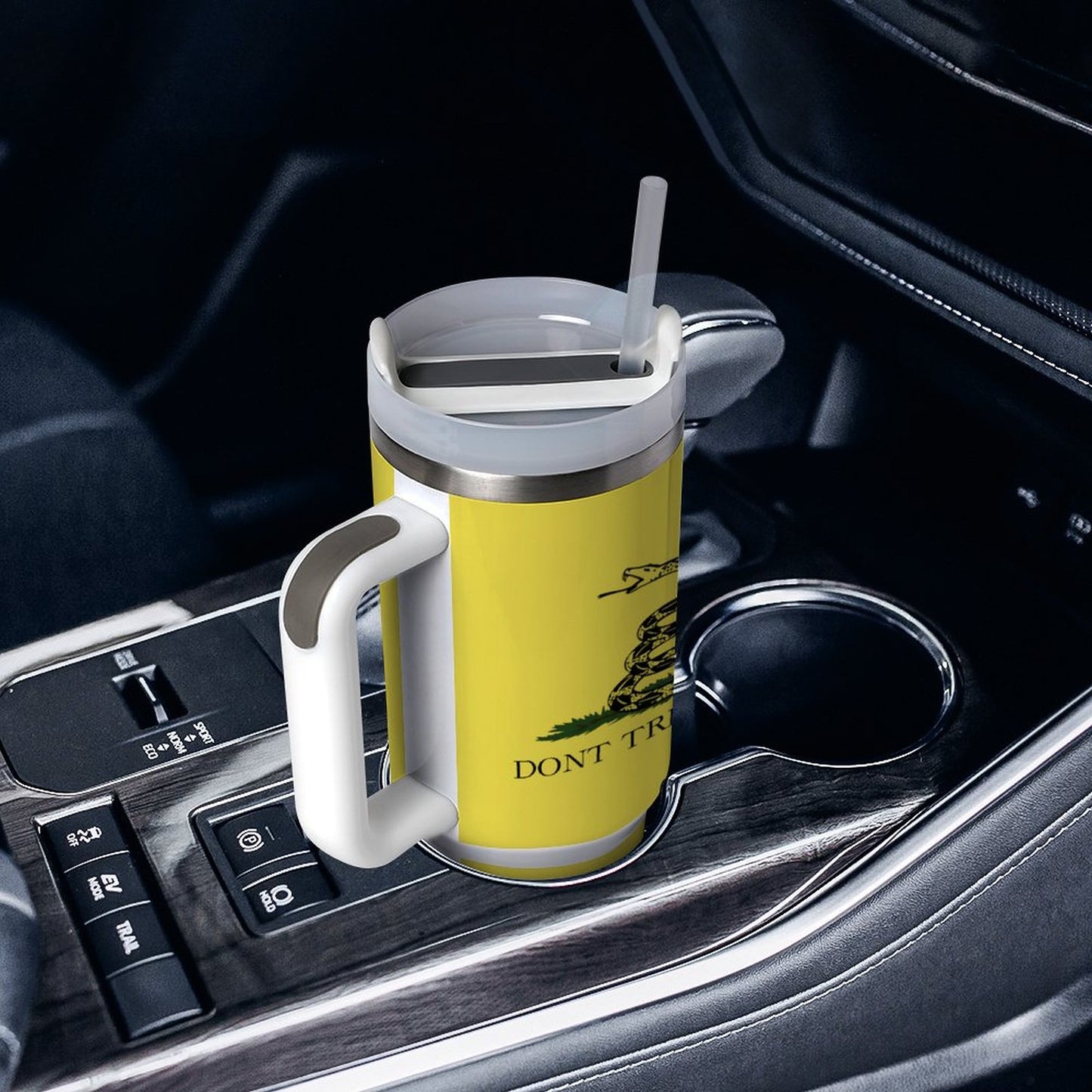 [Brand] travel mug in car holder, yellow with snake design.