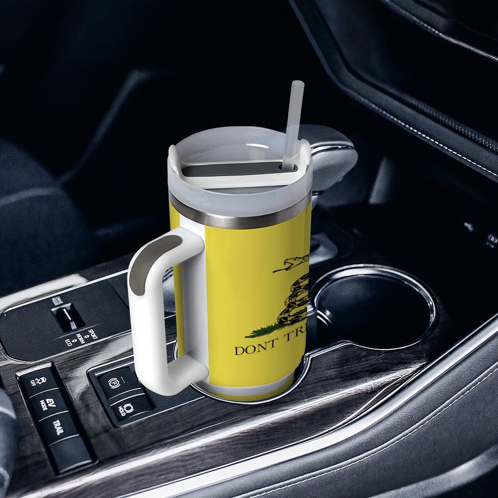 [Brand] travel mug in car holder, yellow with snake design.