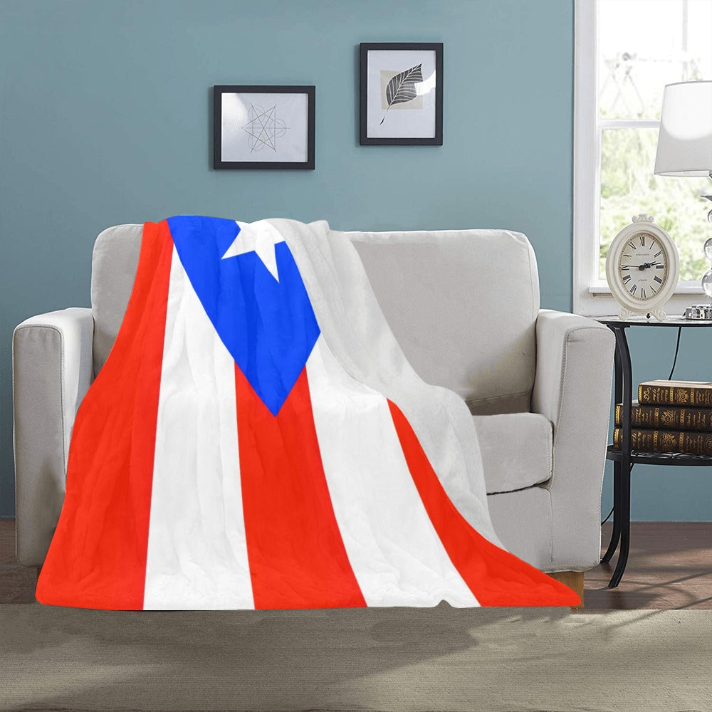 [Luv My Flag] blanket with Puerto Rican design on couch.