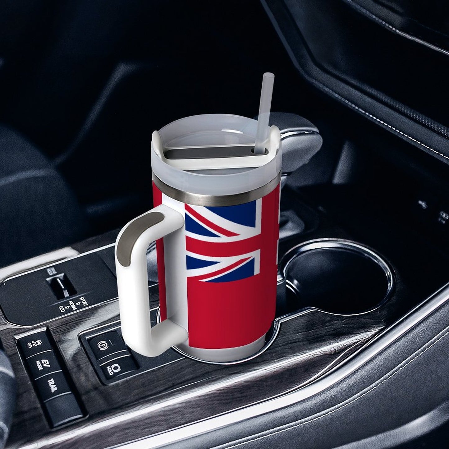 [Brand] travel mug with Union Jack, in car holder.
