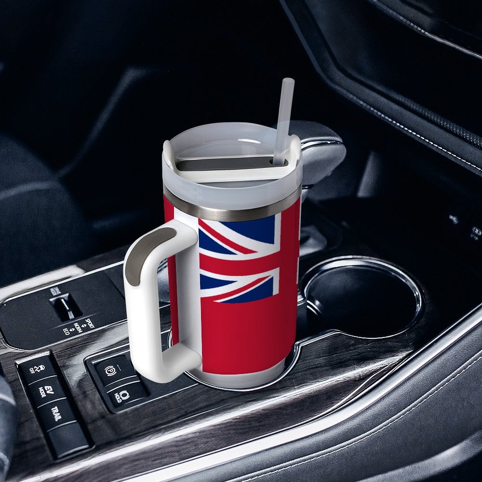[Brand] travel mug with Union Jack, in car holder.