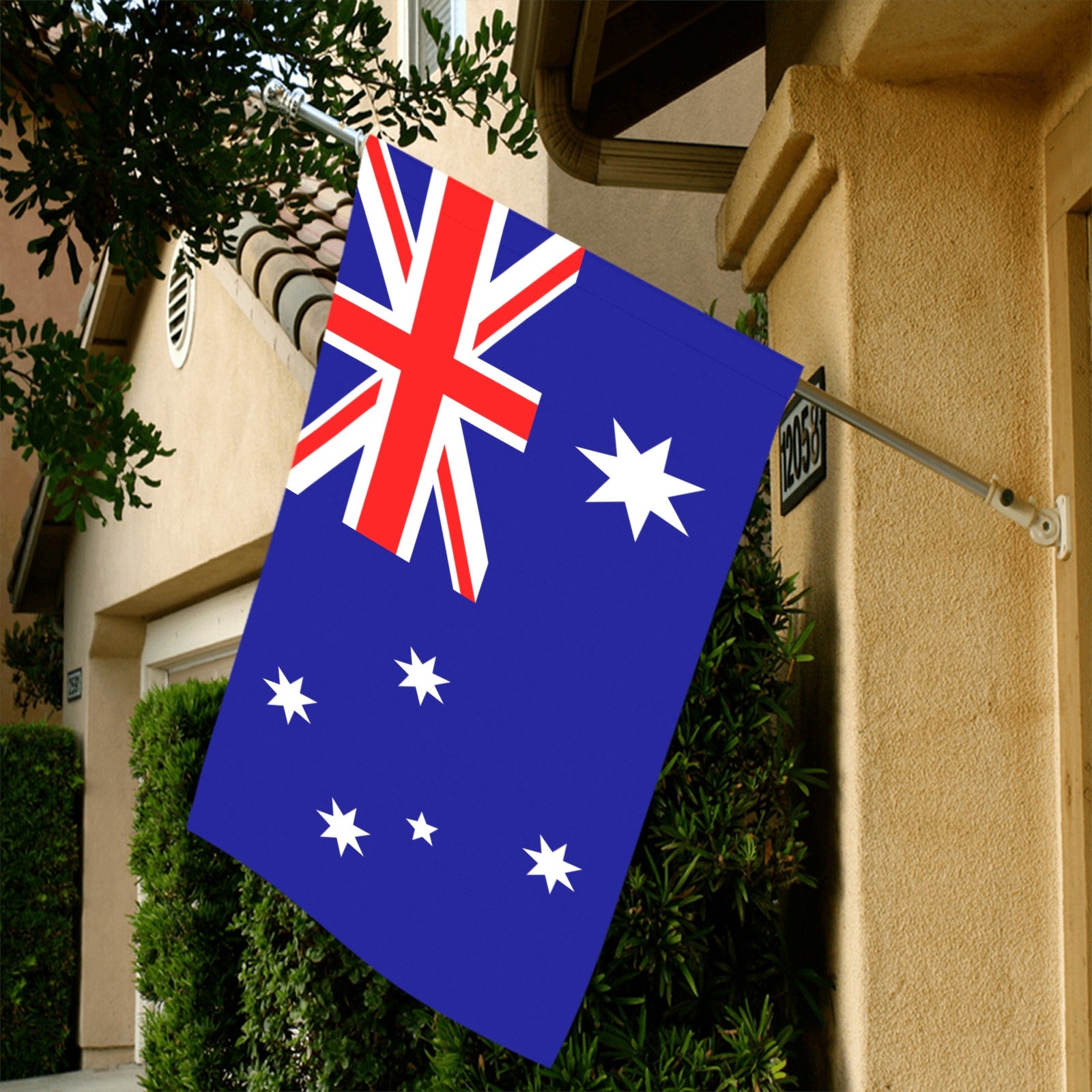 Australian flag displayed outside house by Luv My Flag.