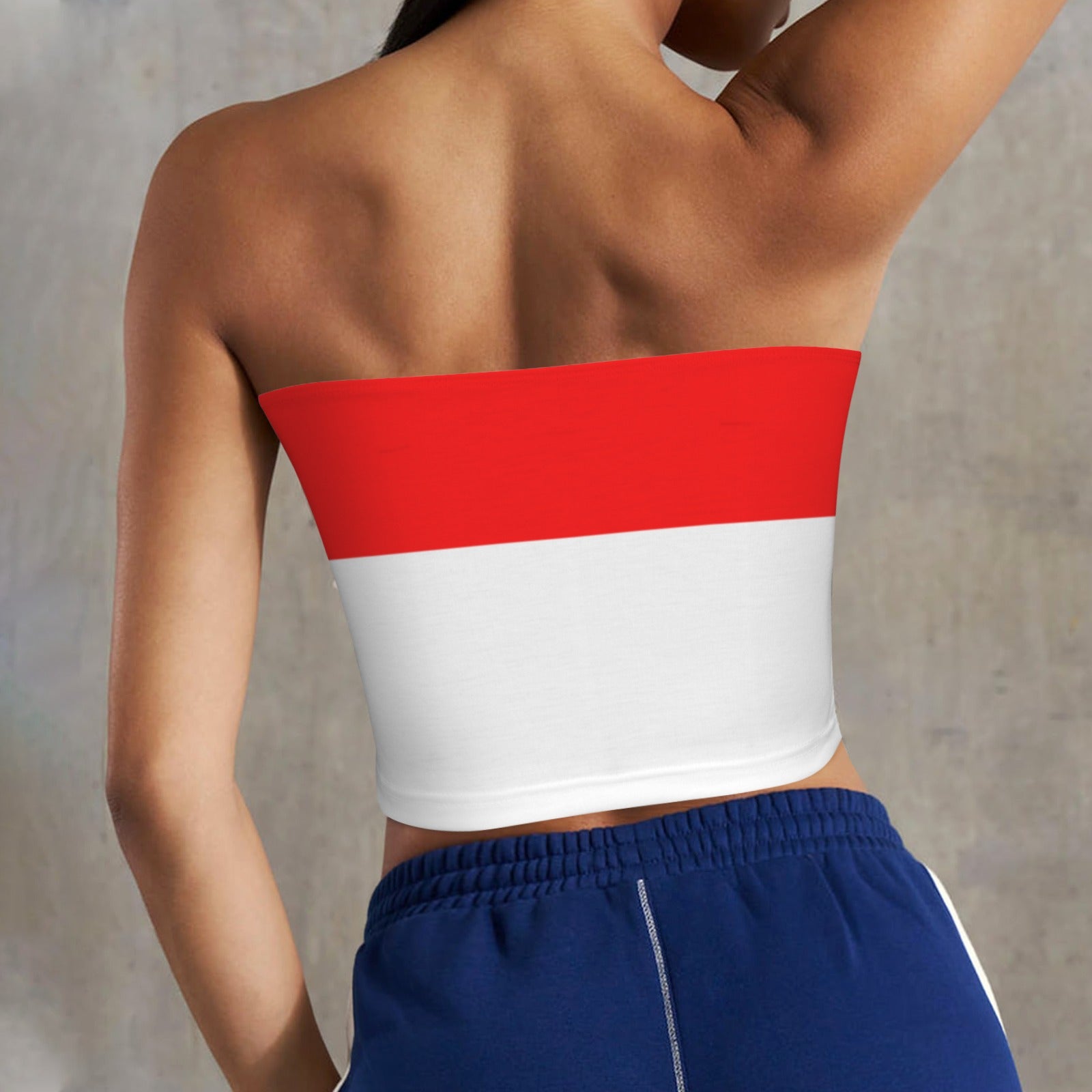 Rear view woman in [Brand] red-white strapless top, blue shorts.