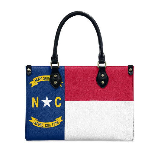 [Brand] handbag featuring the North Carolina state flag design.